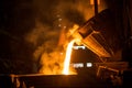 Tank pours liquid metal in the molds at the steel mill