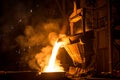 Tank pours liquid metal in the molds at the steel mill