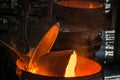 Tank pours metal at the steel mill.