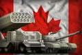 Canada heavy military armored vehicles concept on the national flag background. 3d Illustration