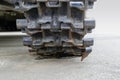 Tank tracks. Caterpillar armored closeup shot. Black track link. Chassis tank. Royalty Free Stock Photo