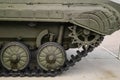 Tank tracks. Tank of the Second World War. Track armor close-up. Black track link and large rubberized rollers. Tank chassis. The Royalty Free Stock Photo