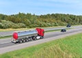 Tank truck transport of liquid, foodstuff. Metal chrome cistern tanker for food transportation on highway. Out of focus, possible