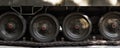 Tank truck and wheel closeup. Military background lateral part of heavy armored vehicles