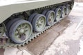 Tank wheels close-up. Iron tracks of a heavy military tank. Iron caterpillars and wheels of a military heavy tank. View of the Royalty Free Stock Photo