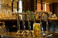 Tankard of beer with beer taps in a pub