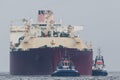 LNG TANKER AND TUGBOATS Royalty Free Stock Photo