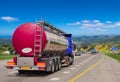 Tanker with chrome tanker on the highway.