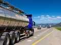 Tanker with chrome tanker on the highway.