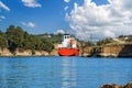 Tanker sails between the rocks of the Corinth Canal, Peloponnese, Greece Royalty Free Stock Photo