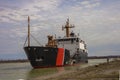 Industrial cargo ship sailing down the Welland Canal. Royalty Free Stock Photo