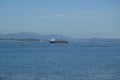 Tanker Ship Navigating The Estuary In Front Of The Horse Point Lighthouse On Arosa Island. Nature, Architecture, History, Travel.