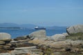 Tanker Ship Navigating The Estuary In Front Of The Horse Point Lighthouse On Arosa Island. Nature, Architecture, History, Travel.