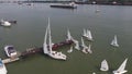 Tanker ship and sailboat on river. Aerial view. Sailboats and a tanker