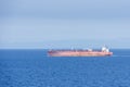 Tanker ship sailing through blue and calm Mediterranean Sea. Royalty Free Stock Photo