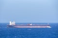 Tanker ship sailing through blue and calm Mediterranean Sea. Royalty Free Stock Photo