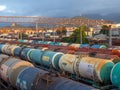 Tanks with fuel on the railway tracks at sunset. Sunset at the train station. Royalty Free Stock Photo