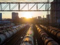 Tanks with fuel on the railway tracks at sunset. Sunset at the train station Royalty Free Stock Photo