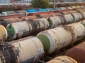 Tanks with fuel on the railway tracks at sunset Royalty Free Stock Photo