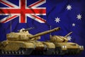 Tanks with orange camouflage on the Australia flag background. Australia tank forces concept. 3d Illustration Royalty Free Stock Photo