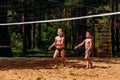 Tanned athletic Caucasian children playing in shorts barefoot in the summer