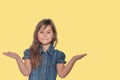 Tanned little girl is posing with outstretched arms with palms up Royalty Free Stock Photo