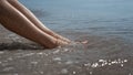Tanned woman legs smeared beach sand on sunlight closeup. Sexy lady sunbathing. Royalty Free Stock Photo