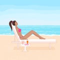 tanned woman lying on the chaise lounge and sunbathing on the beach