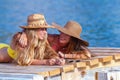 Tanned women sunbathing on beach