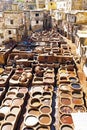 Tanners working leather in the old tannery of Fes, Morocco Royalty Free Stock Photo