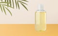 Tanning oil or massage oil bottle mockup realistic vector 3d illustration on beige yellow background with palm leaves