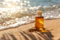 Tanning oil on sandy beach with copyspace area