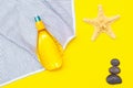 Tanning oil on a yellow background. Smooth tan. Perfect body. The beauty . Sun protection. Beach rest. Article about means for