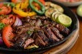 Sizzling Grilled Steak and Veggies on Cast Iron - Perfect for Steakhouse Menu Features Royalty Free Stock Photo