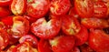 A tantalizing symphony of vibrant, crimson halved tomatoes, brimming with nature\'s bounty, enticing freshness