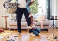 Tantrum, crying and boy on leg of father shouting with anger, frustrated and upset emotions at home. Family, discipline