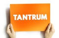 Tantrum - is an emotional outburst, usually associated with those in emotional distress, text concept on card