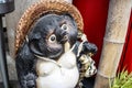Tanuki statue out front of a business in Japan Royalty Free Stock Photo