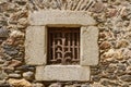 Tany window on a stone wall Royalty Free Stock Photo