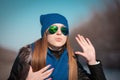 Tanya. Woman face blue hat, sunglasses