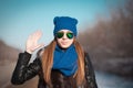 Tanya. Woman face blue hat, sunglasses