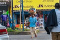 TANZANIA, ARUSHA - 15 Jan 2020: Carry good on the head is african skill. People on the street in Arusha city, Tanzania