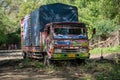 TANZANIA, ARUSHA - JAN 2020: Heavy Cargo Truck Stuck on the Sandy Road in Africa. Putting BranchesUnder Wheels at