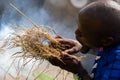 Maasai tribesmen demonstrating fire making at village in Arusha, Tanzania, Africa