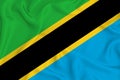 Tanzania flag on the background texture. Concept for designer solutions