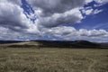 Tanzania, Ngorongoro, crater landscape with beautiful clouds on blue sky background Royalty Free Stock Photo