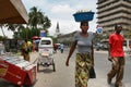 Tanzanian black African woman carries cargo on your head.