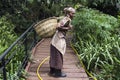 Tanzanian Woman works in coffee farm and carrying basket