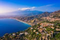 Taormina is a city on the island of Sicily, Italy. Mount Etna over Taormina cityscape, Messina, Sicily. View of Taormina located Royalty Free Stock Photo