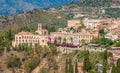 Panoramic sight with Taormina and Etna volcano, from the Ancient Greek Theater. Province of Messina, Sicily, southern Italy. Royalty Free Stock Photo